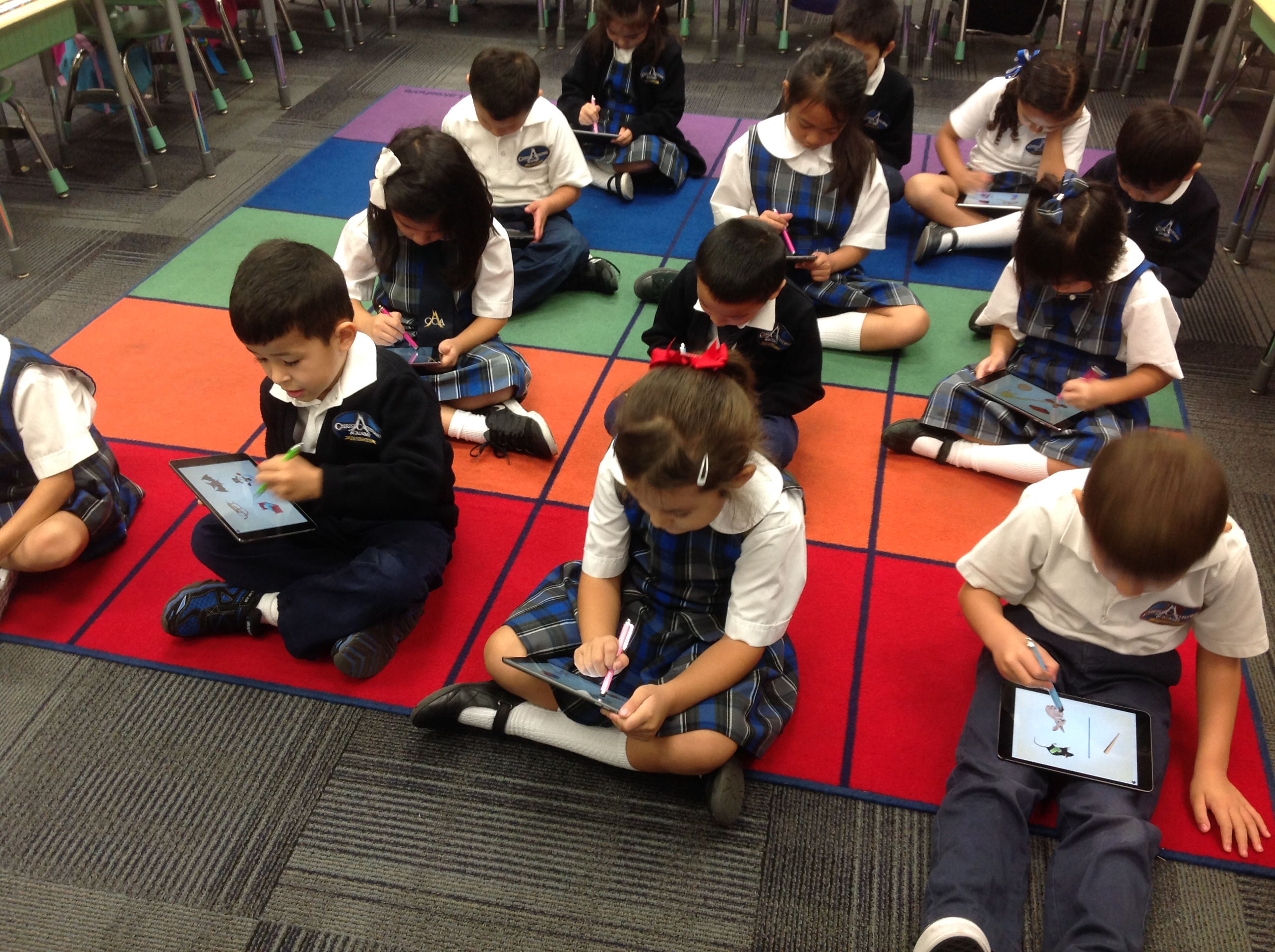 Children using tablets for learning