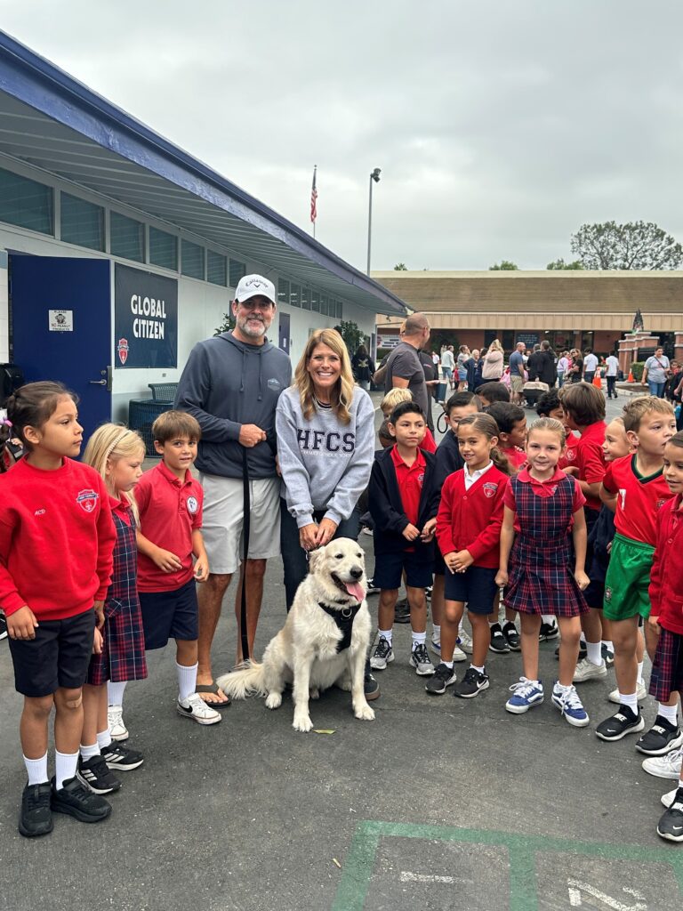 Holy Family Catholic School families bring their pets to school for a blessing.
