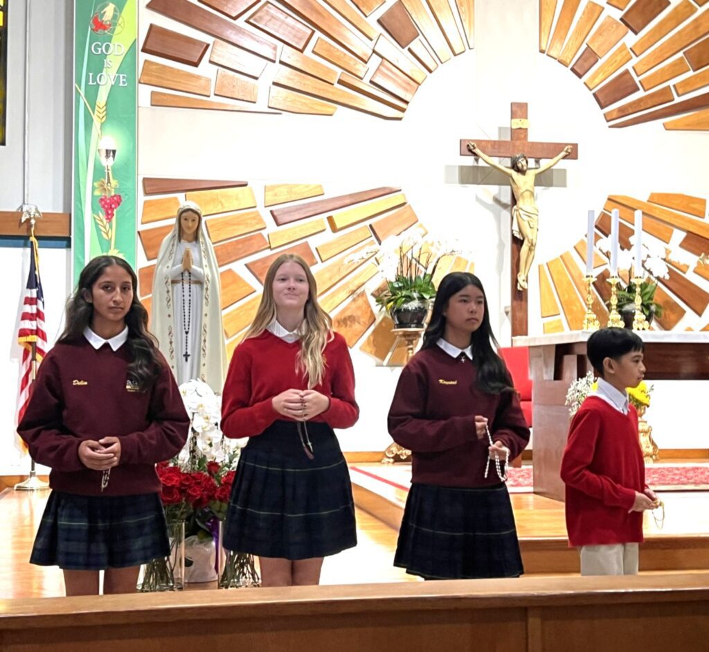 An honored tradition at our Catholic school is the Living Rosary